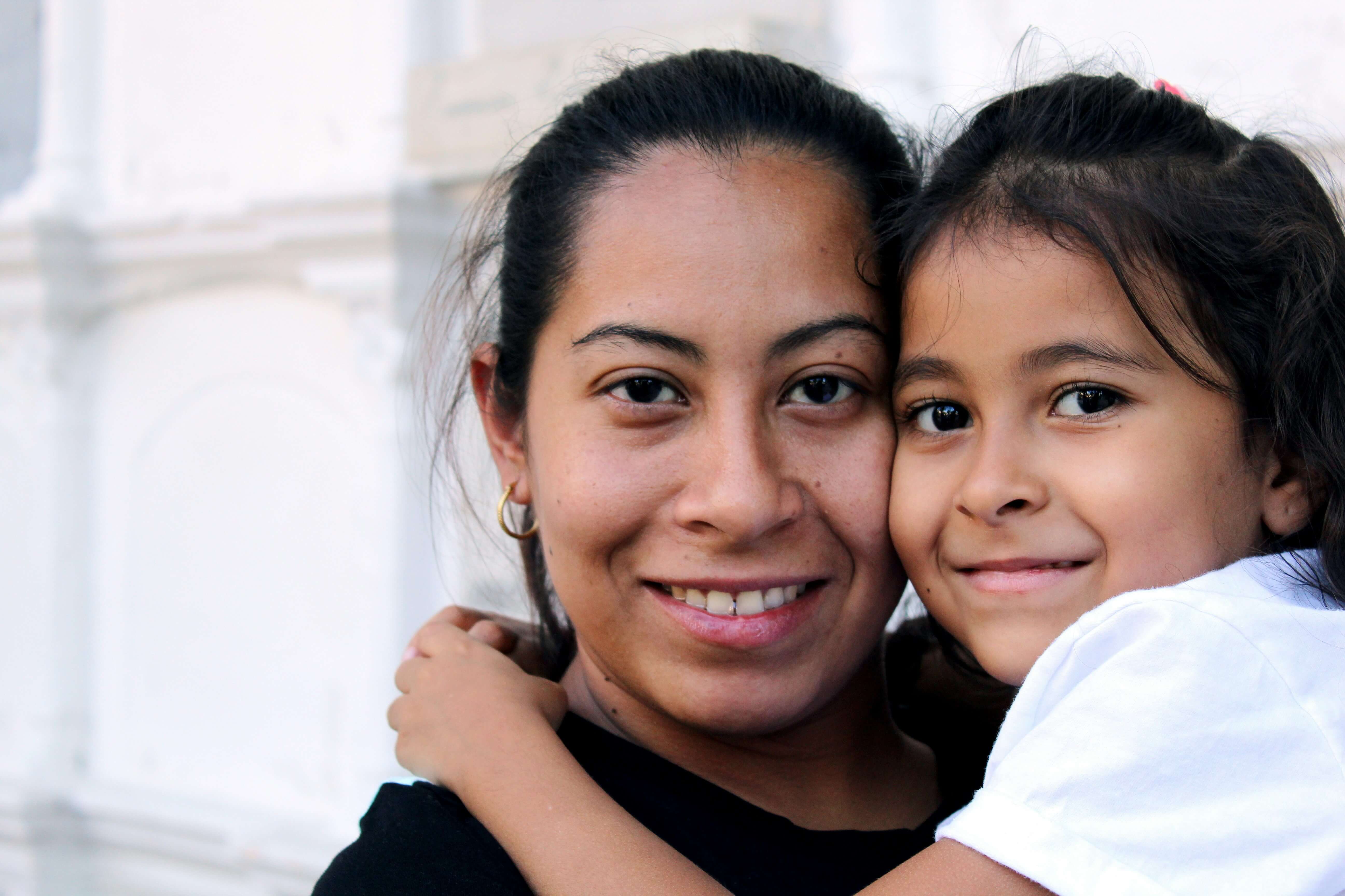 Mother and daughter embracing